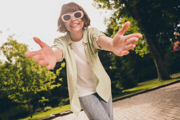 Wall Mural - Portrait of attractive cheerful girl hugging you having fun pastime vacation free time good mood on fresh air outdoors