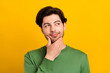 © deagreez - Photo of young happy minded thoughtful man look empty space idea plan smart isolated on yellow color background