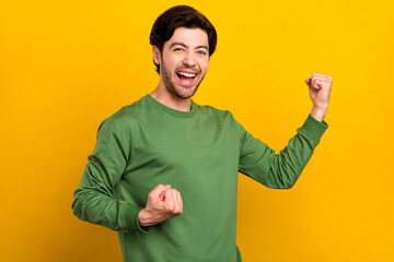 Canvas Print - Photo of cheerful young happy positive man winner enjoy celebrate good mood isolated on yellow color background