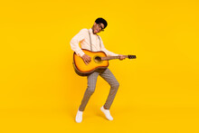 Photo Of Dancer Guy Play Guitar Stand Tiptoe Wear Specs Suspenders Shirt Isolated Yellow Color Background