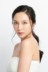 beautiful young asian woman with clean fresh skin on white background, face care, facial treatment, 