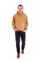 Wall Mural - full length portrait of walking handsome man in beige hoodie isolated on white