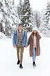 © Di Studio - Happy couple in love walking in winter forest