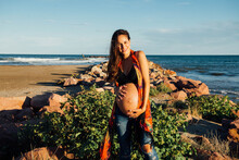Gentle Woman Enjoying Pregnancy On Seashore