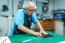 Craftsman Working In Printing Studio