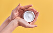 © Olena Apetroaiei - Skin care product. Close-up of women's hands holding a face cream jar. Beauty and spa product.