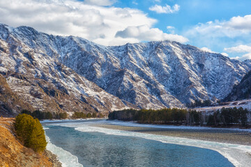 Wall Mural - Winter landscape. River in Altai on a sunny day. Russia