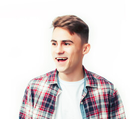 young handsome teenage hipster guy posing emotional, happy smiling against white background isolated, lifestyle people concept