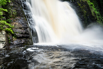 Flowing water from a water fall in a unique perspective, long exposure.