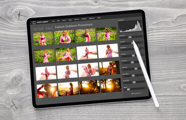 Wall Mural - Digital photo files library on tablet computer