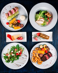 Poster - table set for two with a main course, salad and dessert