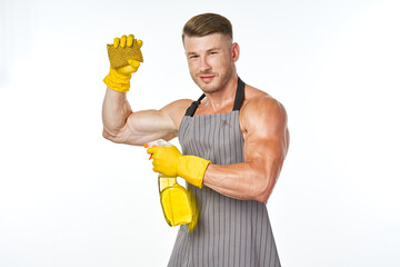 sporty muscular man with detergent cleaning posing