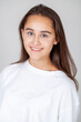 © Andrey_Arkusha - young beautiful happy brunette girl, isolated on gray background