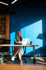 Wall Mural - cinematic image of a senior business woman