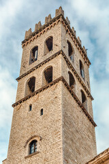 Fototapete - Belltower of the Temple of Minerva, landmark in Assisi, Italy