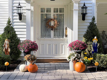 Halloween Or Thanksgiving Decor At The Entryway Of A Traditional Home.