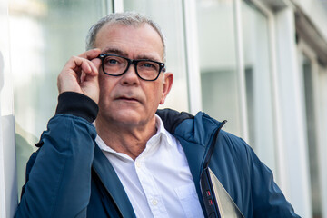 Wall Mural - mature man with glasses and laptop