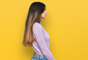 Sticker - Young beautiful teen girl wearing turtleneck sweater looking to side, relax profile pose with natural face and confident smile.