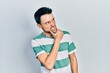 © Krakenimages.com - Young hispanic man wearing casual clothes thinking worried about a question, concerned and nervous with hand on chin