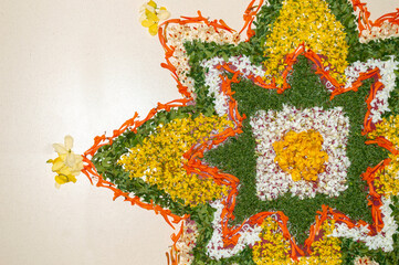 flower decoration on the floor made during onam celebrations in Kerala. Also known as pookalam in malayalam.