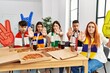 © Krakenimages.com - Group of young hispanic people eating pizza supporting soccer team at home with open hand doing stop sign with serious and confident expression, defense gesture