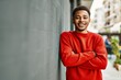 © Krakenimages.com - Handsome african american man outdoors standing over gray wall