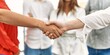 © Krakenimages.com - Group of business workers looking partners handshake at the office.