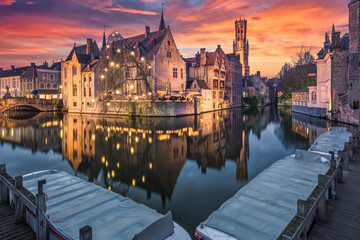 Wall Mural - Historic medieval buildings along a canal in Bruges during amazing sunset, Belgium