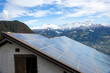 solar power system on barn roof in the mountains, renewable energy