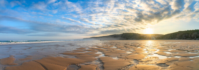 Canvas Print - Watergate Beach at sunrise in Cornwall. UK