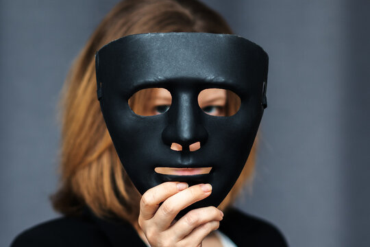 confidentiality,protection of personal data,safety of accounts and passwords on Internet network, woman with a mask in her hand