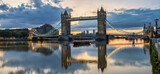 Fototapeta Londyn - Tower Bridge at colourful sunrise with reflection in London. England