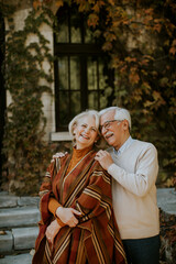 Senior couple embracing in autumn park