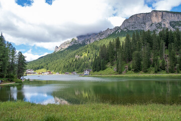 Misurina Lake in calm water. Stunning view on the majestic Dolomites Alp Mountains, Italy, National Park Tre Cime di Lavaredo.