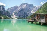 Fototapeta Sypialnia - Lake Braies (also known as Pragser Wildsee or Lago di Braies) in Dolomites Mountains, Sudtirol, Italy. Romantic place with typical wooden boats on the alpine lake. Hiking travel and adventure.