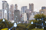 Fototapeta Londyn - Social media icons hologram over panorama city view of Bangkok, Southeast Asia. The concept of people networking, connections and career opportunities. Double exposure.
