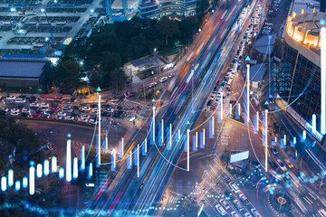 FOREX graph hologram over night busy road traffic in Bangkok, the developed location for stock market researchers in Southeast Asia. The concept of fundamental analysis. Double exposure.