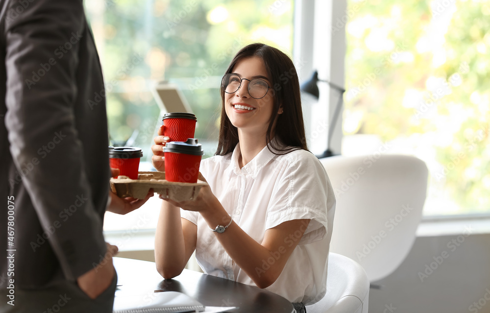 Business people having coffee break in office