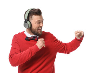 Wall Mural - Young man with headphones dancing on white background