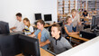 © JackF - Schoolchildren using computers and teacher teaching them in classroom