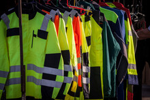 Selective Blur On High Visibility Safety Coats And Jackets, Personal Protective Equipments, For Sale Outside, Fluorescent Colors. These Coats Are Made To Be Visible On Workplace In Any Condition. ..