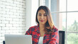 © aFotostock - Happiness Asian Woman working from home using laptop online meeting in home office. Happy relax time asian business woman typing keyboard use notebook laptop Smiling, laughing, yawn at home office.
