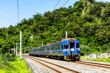 The train is traveling on the tracks in the countryside, Taiwan eastern.