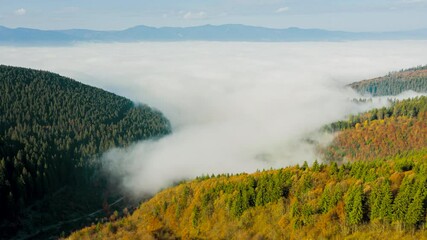 Wall Mural - Aerial Foggy Autumn Mountains Landscape in Alpine Nature at Sunny Morning - Hyperlapse