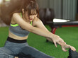 Fit woman cool down after workout, exercise stretching her leg.