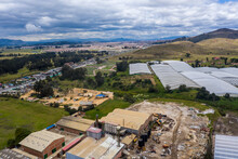 Aerial View Of A Factory With Cultivated Fields On The Outskirts Of The Town Of Sibate In The Department Of Cundinamarca.