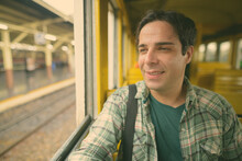 Portrait Of Young Man At Railroad Station