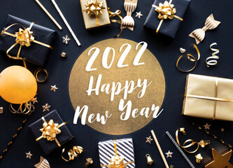 Wall Mural - 2022 happy new year,party and celebration with golden prop and ornament on dark color background