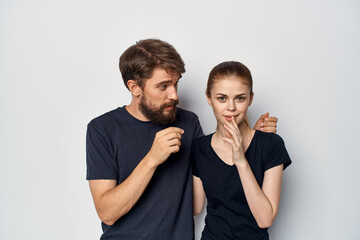 a young couple friendship communication romance wearing sunglasses light background