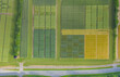 Abstract aerial view of rural landscape with agricultural fields by experimental station.
